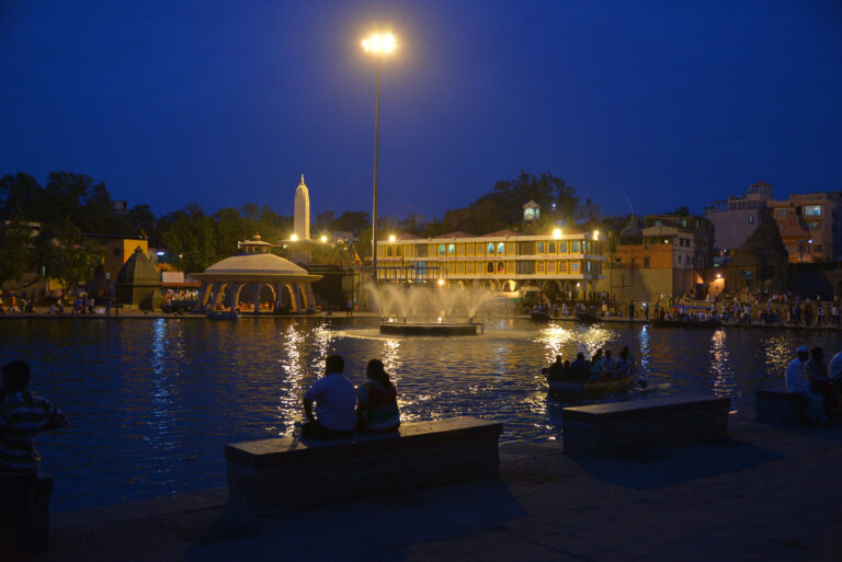 Evening lights reflected on the Godavari River at Goda Ghat in Nashik.